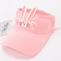 Detail view of pink knitted sun hat featuring cute rabbit ears and flexible open top design - Light Pink