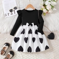 Girls long sleeve dress featuring black ruffled bodice and white heart print skirt - 90cm / Black