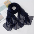 Detailed texture of dark blue sheer georgette scarf with soft draping on white background - Black