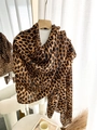 Close-up of leopard print cotton linen scarf texture hanging on a wooden hanger - Brownish Black Leopard (Best-selling Color) / 180*90CM