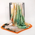 Artistic landscape satin silk square scarf draped on a minimalist display stand - Birch Forest Orange