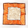 Detailed pattern of a 90cm satin square scarf with orange floral prints and silk texture - Orange Print