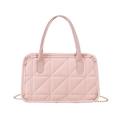 Close-up of pink quilted handbag featuring geometric stitching and gold chain strap detail - Pink