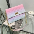 Quilted gradient shoulder bag in pink and blue with a gold chain strap on a glass table - Pink Blue Gradient (Gradient 4)