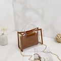 Transparent PVC tote bag with brown leather trim and golden chain strap detail - Brown