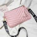 Light pink V-quilted crossbody bag with fringe tassel and LOVE letter fabric strap - Pink