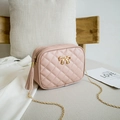 Pink quilted crossbody bag featuring a golden bow buckle and leather tassel detail - Pink (Bow)