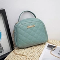 Elegant Morandi blue quilted leather crossbody bag with gold chain and top handle - Blue