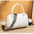 Detail of white quilted Boston bag with gold hardware and removable embroidered strap - White