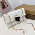 Classic white quilted crossbody bag with gold chain strap and geometric buckle - White