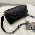 Black quilted crossbody camera bag with adjustable lettered canvas strap on plush rug - Diamond Pattern / Black
