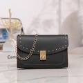 Detail of black crossbody bag with red edges, gold studs, and textured lychee leather - Black