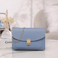 Morandi blue crossbody chain bag with gold rivet edges and a twist lock closure - Blue