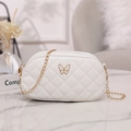 White quilted crossbody bag with golden butterfly logo and elegant chain strap - White