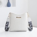 White crocodile pattern bucket bag with golden logo and wide lettered shoulder strap - White