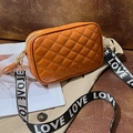 Orange quilted crossbody bag with a wide LOVE letter embroidered shoulder strap - Brown