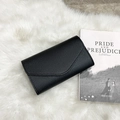 Elegant black bifold clutch wallet with envelope flap on soft white plush background - Black