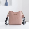 Pink crocodile pattern bucket bag with a stylish black and white lettered webbing strap - Pink