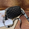 Black quilted crossbody camera bag with gold hardware and LOVE pattern strap - Black