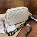 White quilted crossbody bag for women with wide lettered strap and fringe tassel charm - White