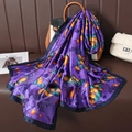 Purple silk scarf with orange ginkgo leaf pattern draped on a brown tote bag - Purple (Ginkgo Leaf)