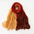 Detailed view of vertical micro-pleats on a tricolor gradient cotton linen scarf - Red + Camel