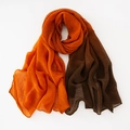 Macro detail of pleated texture and two-tone color block design on a cotton linen scarf - Orange + Army Green