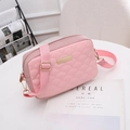 Pink quilted crossbody bag with adjustable strap and elegant gold metal plaque detail - Pink