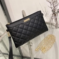 Elegant black quilted crossbody clutch bag with gold chain strap and wristlet strap - Black