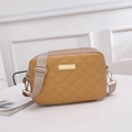 Brown crossbody camera bag featuring scalloped quilting and a wide khaki fabric strap - Apricot