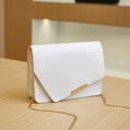 Elegant white crocodile embossed mini crossbody bag with gold chain strap on table - 19*5.5*13 / White