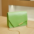 Detail of bright green croc-effect texture with asymmetrical flap and gold chain strap - 19*5.5*13 / Green