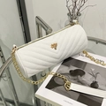 White barrel crossbody bag with chevron quilting and golden tree metallic detail - White