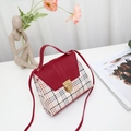 Mini crossbody bag featuring a red litchi texture flap and classic red and white plaid - Red