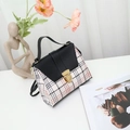 Mini crossbody bag with classic black, white and red plaid pattern and gold lock - Black
