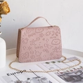 Pink embossed handbag with cartoon motifs, gold chain strap and stylish leather handle - Pink