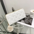 White heart quilted long wallet with golden zipper and beige pom-pom wristlet strap - White