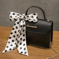 Elegant black faux leather crossbody bag with polka dot silk scarf handle and gold chain - Black