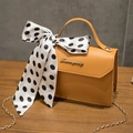 Ginger yellow crossbody bag with lychee grain leather and black polka dot silk scarf - Caramel color