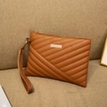 Brown faux leather handbag with quilted stitching and gold hardware detail - Brown