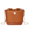 Brown quilted bucket bag with chevron stitching, drawstring closure and chain strap - Brown