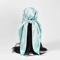 Mint green satin square scarf used as a stylish headscarf on long black hair - Mint Green