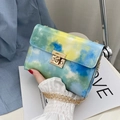 Mini flap square bag featuring blue, green and yellow tie-dye print with golden chain - Blue