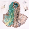 Detailed view of lightweight georgette scarf with artistic branch print and color splicing - Green
