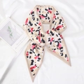 Pink and black leopard print satin skinny scarf displayed on white wrinkled fabric background - Leopard Print