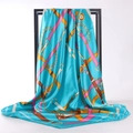 Teal satin silk square scarf featuring pink and gold chain buckle patterns on a display stand - 90*90cm / Aquamarine