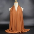 75D pearl chiffon scarf in dark caramel, elegantly draped on a white torso mannequin - Caramel color