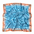 Macro detail of sky blue satin scarf featuring vintage equestrian motifs and orange border - 90x90cm / Sky Blue Orange Border Equestrian Style