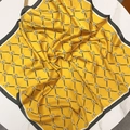 Yellow silk-like square scarf with horse print and black border on a white table - 70*70cm / Yellow