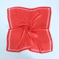 Detailed close-up of a red satin square scarf with white polka dots and silk texture - 60x60cm / Red